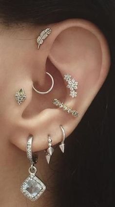 a woman with ear piercings and an ear ring