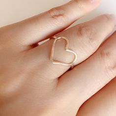 "This listing is for 1 ring I hand shaped this heart ring using fine round metals wire. Then slightly hammered the ring to add textures and shine. This ring is super fun and dainty to wear. You can wear this ring alone, as a midis ring or stack with other rings for a fun beachy look. All rings are hand shaped to order so please allow slight variation. For half size please leave me a note in the \" note for seller \" box as you checkout." Dainty Stackable Open Heart Ring, Rose Gold Open Heart Ring, Heart Charm Open Ring For Promise, Heart Charm Open Promise Ring, Stackable Heart-shaped Open Ring As Gift, Stackable Open Heart Ring As Gift, Stackable Open Heart Ring Gift, Dainty Open Heart Ring With Heart Charm, Rose Gold Open Heart Ring With Heart Charm