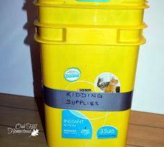 a yellow plastic container sitting on top of a wooden table