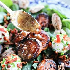 a close up of a salad with meat and vegetables