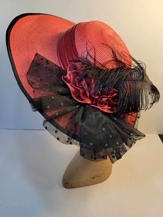 "Vintage hat from 1980's-1990's. Wide-brimmed (cartwheel) hat design embellished with black feather, red roses, pleated polka dot tulle, and trimmed with black ribbon. Looks great with any outfit! Hat is in excellent used condition.  Dimensions: 16.5\" brim diameter, 7.5\" head diameter" Vintage Red Hats For Spring, Red Vintage Hats For Spring, Vintage Red Mini Hat For Kentucky Derby, Red Vintage Mini Hats For Kentucky Derby, Vintage Red Hat For Kentucky Derby, Red Fitted Vintage Top Hat, Vintage Top Hat With Short Brim For Races, Vintage Short Brim Top Hat For Races, Vintage Hats For Kentucky Derby Races