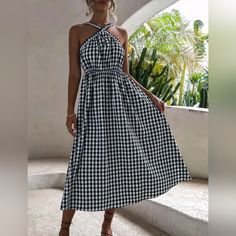 Flowy Chic Gingham Checked Halter Midi Dress * Sleeveless * Criss Cross Halter Neckline, Elastic Back * Flared A Line Skirt * Pullover * High Waist *Approximate Unstretched Measurements* Small 4 *Bust 26.75-39.25" *Waist 26-45" *Length 37" Medium 6 *Bust 28.25-41" *Waist 27.5-48" *Length 37.5" Large 8/10 *Bust 30.5-43" *Waist 30-51" * Sleeve Length 15.5" * Length 38.25" Xl 12 *Bust 33-45" *Waist 32-53" Sleeve Length 15.5" * Length 39" ** On Order ** Will Ship In 7- 14 Days * Fabric Flowy Poly Co Summer Black Plaid Dress, Gingham Midi Sundress For Picnic, Summer Gingham Midi Dress For Picnic, Gingham Sundress For Picnic, Summer Vacation Plaid Midi Dress, Sleeveless Summer Plaid Dress, Chic Sleeveless Plaid Dress For Picnic, Sleeveless Plaid Dress For Vacation, Casual Sleeveless Plaid Dress For Brunch