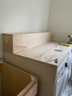 an unfinished kitchen counter is being worked on