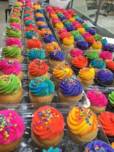 there are many cupcakes with different colors on them