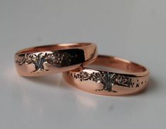 "Tree design wedding bands in 14K Rose gold designed with a slight taper making them very comfortable. The tree design have detailed leaf pattern which is unique on each ring because they are individually done, lightly oxidized to darkened the tree. Tree Of Life - Live, Love and take care of this earth we live in. Share your love of life on this planet with the one you love. A wonderful choice for renewing your vows or as an anniversary gift. Celebrate harmony and balance in your lives. Last 2 p Rose Gold Engraved Ring Stamped 14k For Wedding, Rose Gold Engraved Ring For Wedding, Tree Of Life Ring Wedding Bands, Symbolic Gold Jewelry With Tree Of Life, Tree Of Life Jewelry Gold, Rose Gold Tree, Elegant Yellow Gold Tree Of Life Jewelry, Elegant Yellow Gold Tree Of Life Necklace, Tree Of Life Ring