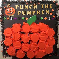 a bulletin board with pumpkins on it and the words punch the pumpkin written in large letters