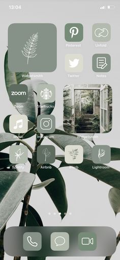 an iphone screen showing the home screen with icons on it and plants in the background