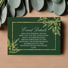 a green wedding card with greenery and gold trimmings on the front, sitting next to some leaves