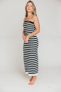 This dress is a summer must-have, whether you're looking forward to a cruise, a week of island-hopping in the Mediterranean, or a staycation at the neighbor's pool! The Eventide Maxi Dress is crafted from a comfortable cotton blend and features a slimming, strapless silhouette. Pair it with slides or tennis shoes for sightseeing, or with wedges for dinner at the resort! FIT: Runs true to size - fitted. MODEL: Model is 5’7” / wearing a small. MATERIAL: 48% Cotton, 40% Acrylic, 12% Nylon. GARMENT Summer Strapless Dress For Beach Cover-up, Strapless Summer Dress For Beach Cover-up, Summer Strapless Maxi Dress For Vacation, Strapless Maxi Dress For Beach In Summer, White Maxi Dress For Poolside And Beach Season, Summer Strapless Maxi Dress For Beach, Strapless Beachwear Sundress For Day Out, Strapless Midi Dress For Summer Beach, Chic Strapless Summer Beach Dress