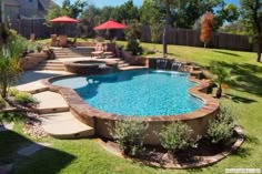 an outdoor swimming pool surrounded by lawn furniture and umbrellas