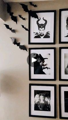 black and white pictures hanging on the wall in a living room with bats flying overhead