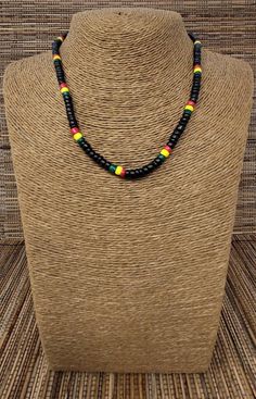 "Rasta Necklace. Wooden Necklace. Unique design with Black color wooden beads. Also available in brown color. Handmade with rasta color wooden beads, black color wooden beads, cord and barrel clasp. Unisex Design. Necklaces is 18\" Inches Around the neck FAST & FREE SHIPPING! *First Class Mail Visit my Etsy Shop to see more Designs! Handmade Rasta Wooden Earrings, Rasta Bracelets and Necklaces. Click here to see more designs: https://www.etsy.com/shop/FreedomLifeStyle" Black Wooden Beaded Necklaces For Festival, Black Wooden Beads Necklace For Festival, Adjustable Black Beaded Necklace With Wooden Beads, Black Wooden Beaded Necklace For Festivals, Adjustable Black Wooden Beaded Necklace, Rasta Necklace, Rasta Jewelry, Africa Necklace, Ankh Necklace