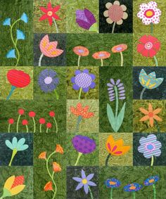 a patchwork quilt with flowers on it and green grass in the background, all made up of different colors