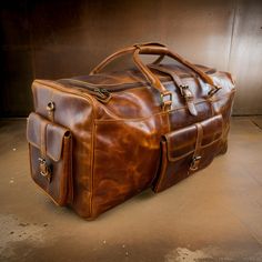 Genuine Leather Travel Duffel Bag. PURE LEATHER: Bags are made of full grain genuine leather. Vintage inspired design combined with the distressed leather gives a rich classy look. SIZE: 22''x 10'' x 10", Exterior side pockets slot designed for easy access to stow your Shoes, Open Pockets within the front pocket can be a great place for your belongings like mobile phone, wallet, headphones. Use it for a mini vacation, gym or for just running around town; this leather weekender bag will certainly Leather Bags For Overnight Trips, Leather Rectangular Satchel For Overnight Trips, Rectangular Leather Duffle Bag With Smooth Grain, Leather Bags With Leather Backing For Overnight Trips, Rectangular Leather Travel Bag In Cognac, Rectangular Leather Duffle Bag With Leather Backing, Rectangular Bag With Smooth Grain For Overnight Trips, Rectangular Bags With Smooth Grain For Overnight Trips, Luxury Rectangular Oiled Leather Bag