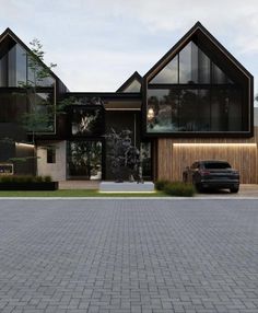 a car is parked in front of some modern houses