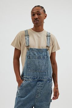 Baggy fit overalls by the essential BDG denim label. Classic bib front overalls with adjustable shoulder straps and utility pockets. Urban Outfitters exclusive. Features BDG Nitro baggy overall Workwear bib front overalls Adjustable shoulder straps Pouch front pocket Utility pockets UO exclusive Content + Care 100% Cotton Machine wash Imported Size + Fit Model in Charcoal is 6’2" and wearing size 32 Measurements taken from size 32 Length: 65" Rise: 13.5" Inseam: 29" Leg opening: 11" | BDG Nitro Utility Style Relaxed Fit Shortalls With Pockets, Relaxed Fit Medium Wash Overalls With Adjustable Straps, Relaxed Fit Utility Shortalls With Pockets, Utility Style Shortalls With Pockets And Relaxed Fit, Casual Bib Front Overalls For Streetwear, Utility Denim Overalls With Adjustable Straps, Utility Overalls With Side Pockets For Streetwear, Casual Medium Wash Shortalls With Pockets, Relaxed Fit Shortalls With Side Pockets