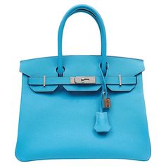 This authentic Hermès Sky Blue Epsom 30 cm Birkin is in pristine condition. Hand sewn and coveted worldwide; the Hermès Birkin is considered the epitome of luxury handbags. Vivid Cotton Candy Blue from the 2020 collection is perfectly paired with Palladium hardware for maximum impact. Durable Epsom leather is textured and lightweight. It is known for absorbing color brilliantly. Chevre (goat hide) interior has one side zippered pocket. Palladium hardware and double rolled handles. Y stamp. Made Hermes Birkin Malachite, Gucci Floral, Hermes Handbags, Purse Styles, Nike Fashion, Hermes Bags, Bags Shoes, Green Bag, Hermes Birkin