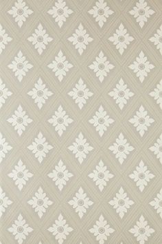 a white and gray wallpaper with an intricate design on it's side,