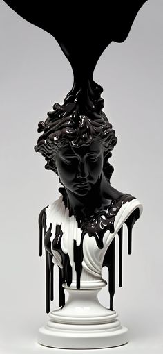 a black and white statue with dripping paint on it