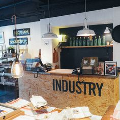 the inside of an industrial store with various items on display and lights hanging from the ceiling