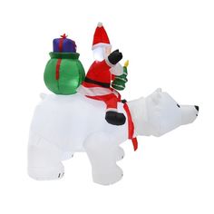 an inflatable polar bear and santa clause riding on top of it's back