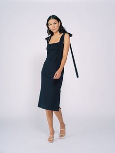 Tied shoulder strapsMidi length dressHigh side slitsColor: NavyContent: 60% cotton, 40% spandex Cotton Midi Dress With Adjustable Straps For Brunch, Chic Fitted Midi Dress With Tie Sleeves, Cotton Midi Dress With Tie Straps, Cotton Midi Dress With Tie Back, Chic Cotton Midi Dress With Side Slits, Cotton Midi Dress With Straight Neckline For Brunch, Date Night Midi Dress With Tie Straps, Cotton Midi Dress With Knotted Straps, Fitted Dress With Knotted Straps And Straight Neckline