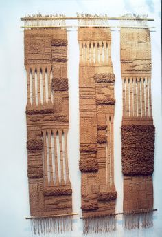 an art piece made out of woven material with fringes on the bottom and sides