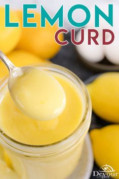 a spoon full of lemon curd sitting on top of a table