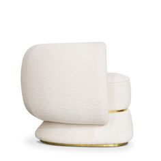 a white chair sitting on top of a gold base