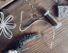 some beads and other items on a wooden table