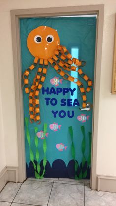 a door decorated to look like an octopus with the words happy to sea you