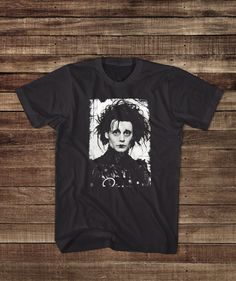 His story will touch you, even though he can't. This classic Johnny Depp and Tim Burton retro movie shirt bring back the 90s nostalgia. * All of our items are handmade and made to order!* All of our garments are high quality, name brand apparel like Fruit of the Loom, Gildan, Anvil and Bella & Canvas. The brand and style of garment is always specific to the listing/design. If you would like a certain design printing on something different than shown in the listing, please send us a convo and we will make you a custom order :) Sizes Available: Small, Medium, Large, XL and 2XL.  (please get in touch if you need something larger) -> All USA orders shipped direct with USPS & full tracking! <- For hygienic reasons we do not accept returns however if we made mistake with your order (not likely, Tim Burton Tshirt, Film Clothes, Horror Clothes, Monster Movies, Brand Apparel, Shirts Ideas, Winona Ryder, Horror Film, Movie Shirts