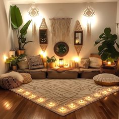 a living room filled with lots of furniture and candles on top of the rugs