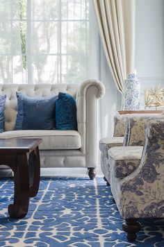 a living room with blue and white decor