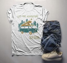 Men's Camping T Shirt Pop Up Van Retro Shirt Adventure Begin Tshirt Explore Nature Graphic Tee Start your next adventure off on the right foot in a graphic tee printed just for you. This retro t-shirt features a pop up style van which you just don't see anymore. The vintage retro style of this camping shirt will always be in style. It also features a forest, retro font and reads 'Let The Adventure Begin'. It doesn't matter where your next adventure takes you, enjoy the journey. Perfect for campi Mens Camping, Wolf T Shirt, Hoodie Size Chart, Cotton Gifts, Explore Nature, And So The Adventure Begins, Retro Shirts, Womens Size Chart, Retro Tshirt