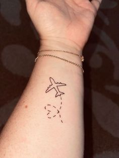 The 90 Most Popular Symbols For Travel Tattoos | Unique & Cute Travel Tattoo Ideas Travel Tattoo Wrist, Minimal Tattoos For Women On Wrist, Traveling Matching Tattoos, Wrist Travel Tattoo, Globe Travel Tattoo, Minimal Tattoo Travel, Travel Wrist Tattoos, Cute Airplane Tattoo, Simple Airplane Tattoo