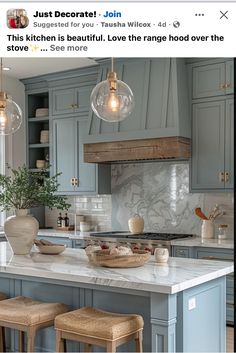 a kitchen with blue cabinets and white marble counter tops is featured on instagrams