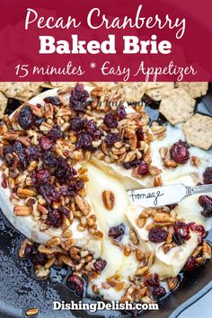 an image of baked brie with cranberries and pecans on the side