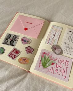 an open book with stickers and magnets on it