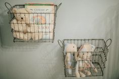 two metal baskets with stuffed animals in them