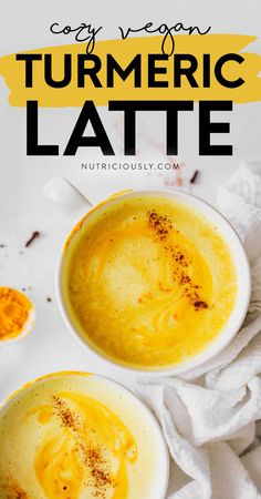 two white bowls filled with creamy turment latte on top of a table