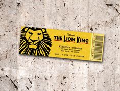 a ticket for the lion king on a concrete wall