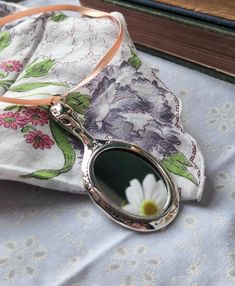 "A beautiful gift for the woman who has everything. This hand mirror has an ornate Victorian-inspired design. It weights about 15 grams and is 2.75\" long. Crafted of sterling silver and marked 925, this is a beautiful and unique sterling keepsake.  Order will ship out within 1-3 business days, from my Ozark studio. In addition to your jewelry, you'll receive a polishing cloth and mini art print. If you have any questions, please send me a message. I'm happy to help :) ABOUT PROSEBUD -------------------------------------- Prosebud is located in the Arkansas Ozarks and is inspired by art, literature, and vintage aesthetics. Every Prosebud giftbox arrives beautifully packaged with vintage fabric and ribbon. All orders include an art extra and polishing cloth. Our jewelry is a mix of handmade Victorian Hand Mirror, Bedroom Vanity Decor, Cottagecore Accessories, Petite Earrings, Victorian Necklace, Unique Mirrors, Bedroom Vanity, Vanity Decor, Chatelaine