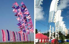 there are many kites flying in the sky and on the ground at this event