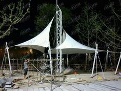 a large white tent sitting on top of a sidewalk