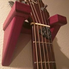 a close up of a guitar neck and strings