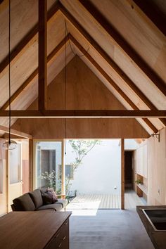 an open living room with wooden walls and ceiling