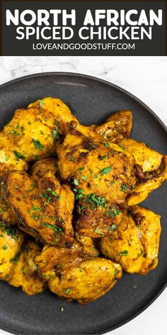 a plate full of chicken with parsley on top and the words north african spiced chicken