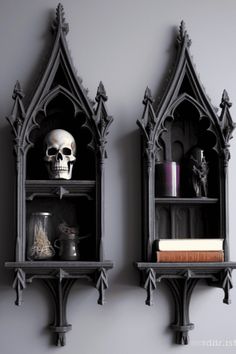 two gothic styled bookshelves with skulls on them