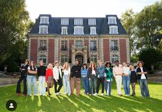 a group of people standing in front of a building